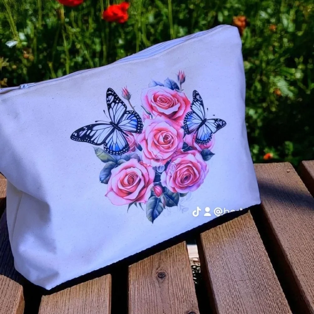 Chic White Cosmetic Bag with Floral and Butterfly Design
